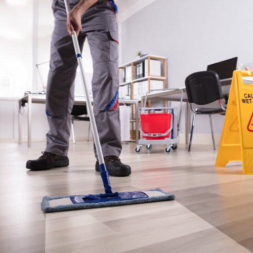 A day porter cleaning a commercial building